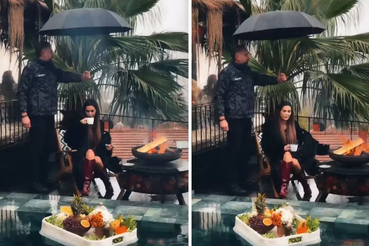 Dilan Polat korumasına şemsiye tutturup keyif yaptı